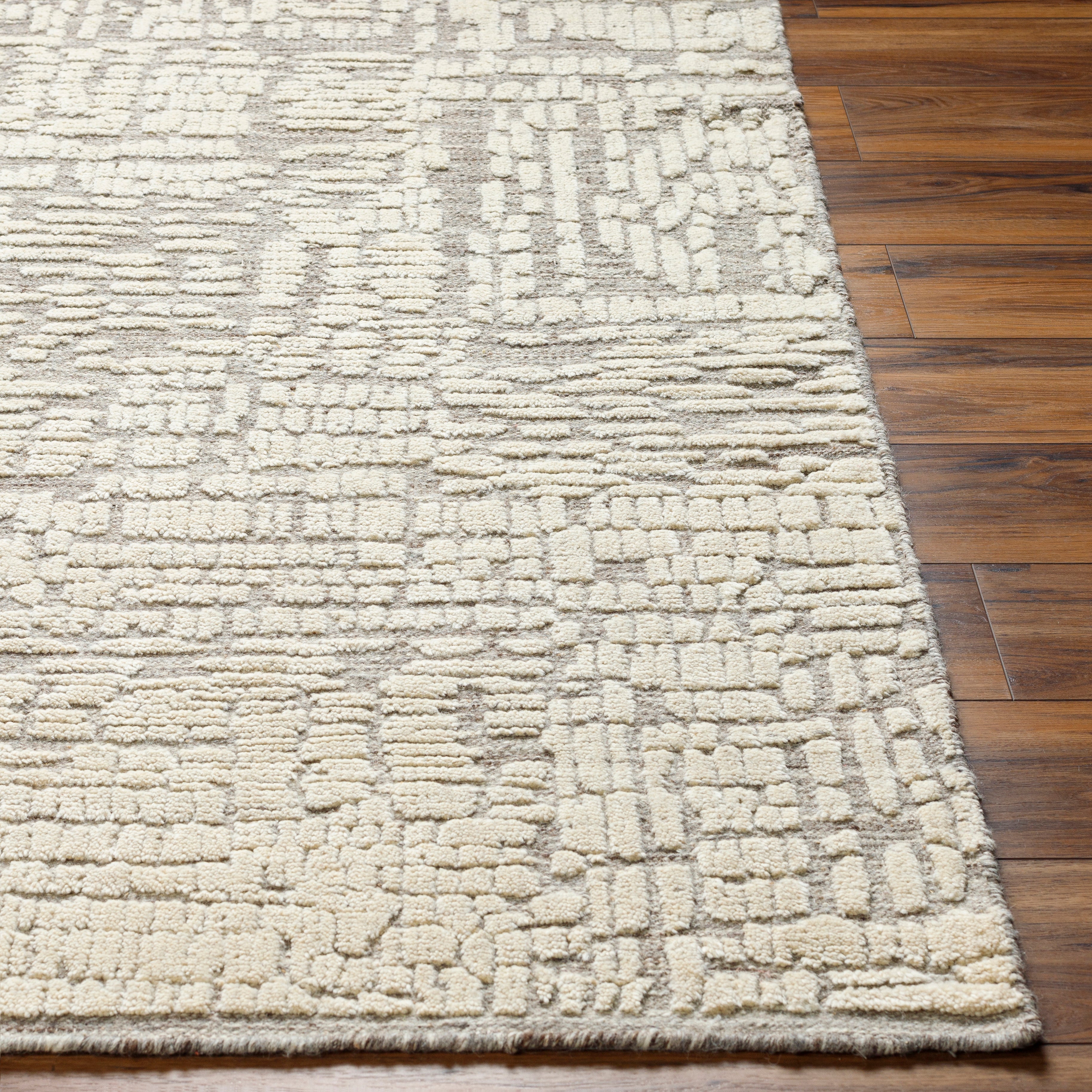 Introducing the Tunus Molly rug, hand-knotted from 100% wool and woven into an abstract, geometric pattern. Featuring taupe and ivory colors, this stylish and warm rug brings modern sophistication to any space. Amethyst Home provides interior design, new home construction design consulting, vintage area rugs, and lighting in the Kansas City metro area.