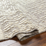 Introducing the Tunus Molly rug, hand-knotted from 100% wool and woven into an abstract, geometric pattern. Featuring taupe and ivory colors, this stylish and warm rug brings modern sophistication to any space. Amethyst Home provides interior design, new home construction design consulting, vintage area rugs, and lighting in the Tampa metro area.
