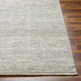 The Tunus Pewter Rug features a globally inspired design made from wool. The hand-knotted rug adds wabi sabi charm to any room. Amethyst Home provides interior design, new home construction design consulting, vintage area rugs, and lighting in the Kansas City metro area.