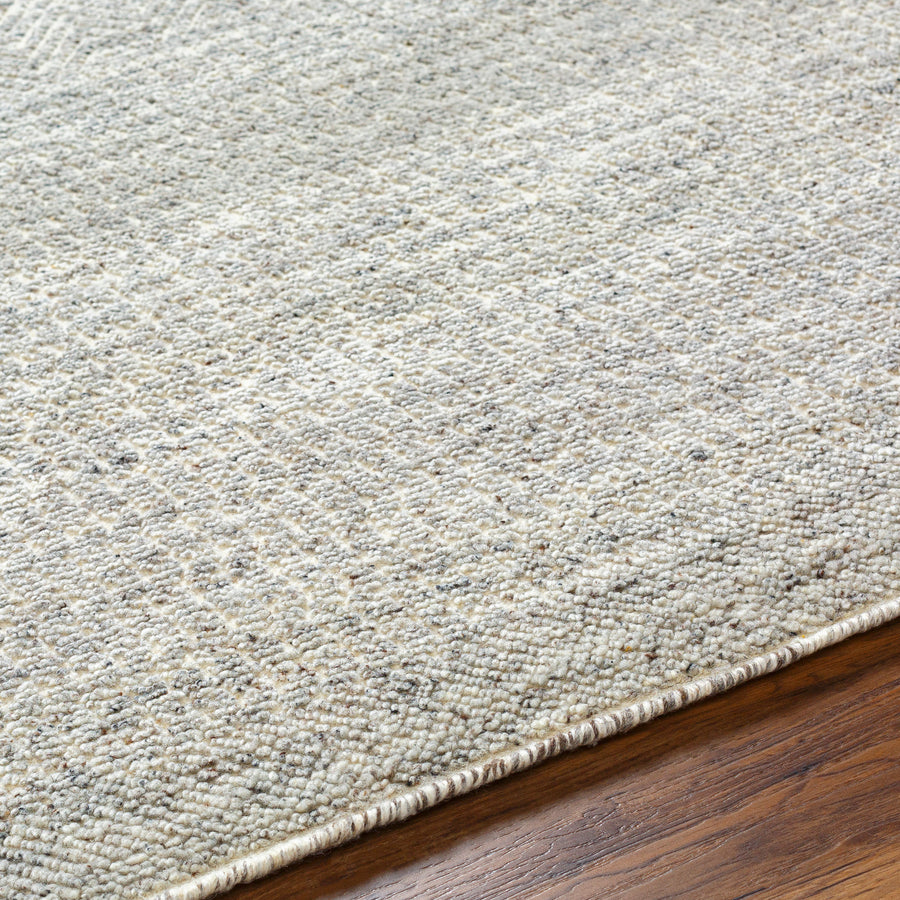 The Tunus Pewter Rug features a globally inspired design made from wool. The hand-knotted rug adds wabi sabi charm to any room. Amethyst Home provides interior design, new home construction design consulting, vintage area rugs, and lighting in the Miami metro area.