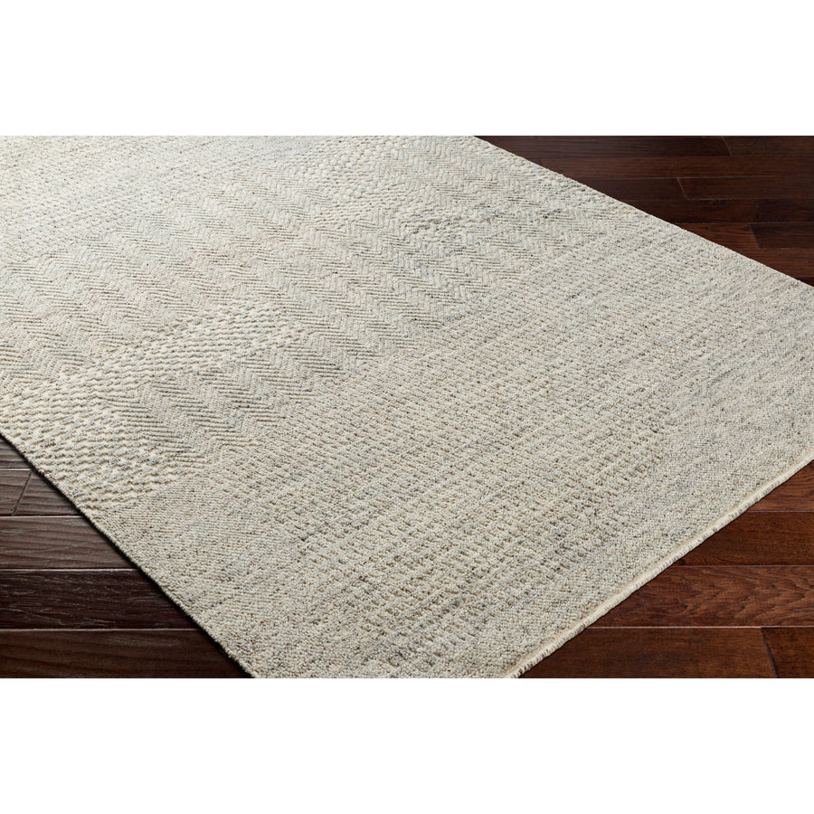 The Tunus Pewter Rug features a globally inspired design made from wool. The hand-knotted rug adds wabi sabi charm to any room. Amethyst Home provides interior design, new home construction design consulting, vintage area rugs, and lighting in the Tahoe metro area.