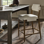 Featuring Tamari Antwerp Natural  Bar + Counter Stool by Four Hands at Amethyst Home. Light-finished solid ash frames linen-blend high-performance seating, bringing a bright, organic look to this bar stool. Performance fabrics are specially created to withstand spills, stains, high traffic and wear, ensuring long-term comfort and unmatched durability. Steam fabric regularly for a . Amethyst Home provides interior design, new construction, custom furniture, and area rugs in the San Diego metro area