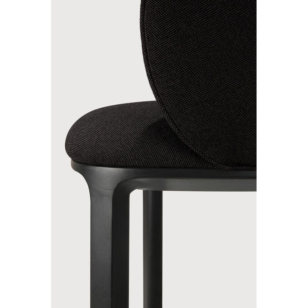 Featuring Unda Charcoal Oak Black Dining Chair by Ethnicraft at Amethyst Home. Experience dining comfort like never before with the Unda. Defined by its blend of materials, fluid lines and crafted piping trace the contours of the upholstered shell. Designed by Studio Segers, known for their pure and honest approach, every detail—down to the uniquely shaped legs—reflects sophisticatio. Amethyst Home provides interior design, new construction, custom furniture, and area rugs in the Dallas metro area