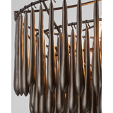 Featuring Vacarro Medium Chandelier Antique Bronze Leaf by Visual Comfort at Amethyst Home. The Vacarro by Julie Neill transforms classic basket chandeliers into a new and unique design statement. Hanging from the basket frame are sculptural, elongated plaster teardrops that create an unexpected texture while light emanates from within the basket. Available in all white or with a met. Amethyst Home provides interior design, new construction, custom furniture, and area rugs in the Boston metro area