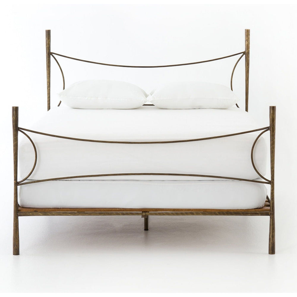 Featuring Westwood Bed by Four Hands at Amethyst Home. Beguiling curves soften hard materials for marked drama with this Westwood Bed. Slim, hammered iron is finished in antique brass for depth that defies this frame's feminine air. Low-profile box spring recommended.
Colors: Antique BrassMaterials: Iron
Queen Overall Dimensions:  62.00"w x 84.00"d x 51.00.  Amethyst Home provides interior design, new home construction design consulting, vintage area rugs, and lighting in the Park City metro area.