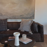 The Clemence Sofa features a minimalist design with clean, low-profile lines, complemented by plush cushions and luxurious throw pillows. Amethyst Home provides interior design, new home construction design consulting, vintage area rugs, and lighting in the Winter Garden metro area.