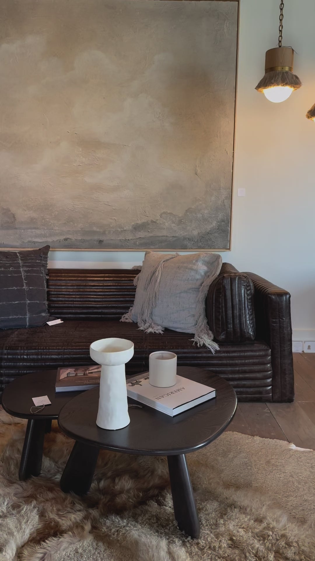 The Clemence Sofa features a minimalist design with clean, low-profile lines, complemented by plush cushions and luxurious throw pillows. Amethyst Home provides interior design, new home construction design consulting, vintage area rugs, and lighting in the Winter Garden metro area.