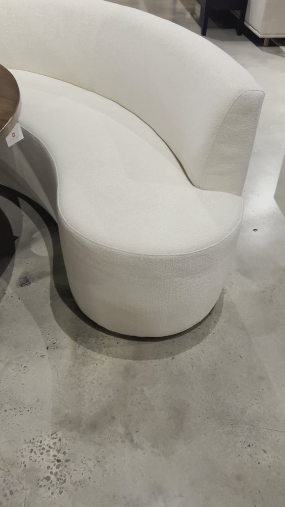 Featuring a dramatically shaped and tightly tailored look, the Sanda dining banquette in an ivory high-performance fabric places a sensible twist on an elegant dining bench. Amethyst Home provides interior design, new home construction design consulting, vintage area rugs, and lighting in the Park City metro area.