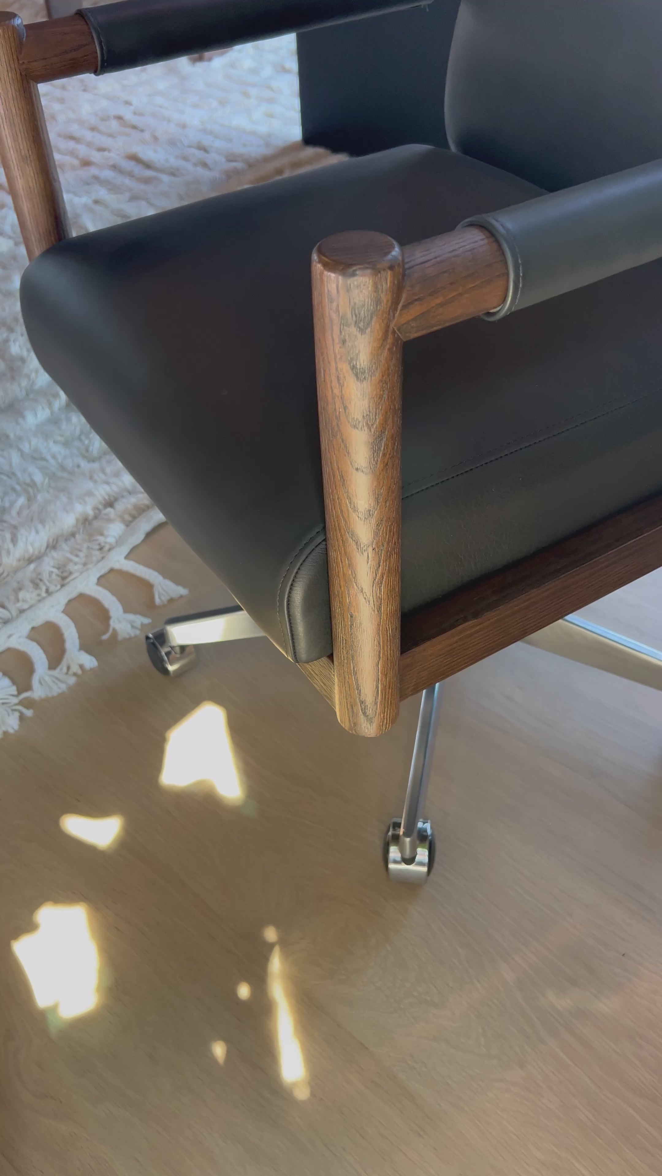 An Amethyst fave -- the Levi Black Leather Desk Chair is modern yet inviting.  Gorgeous black leather with a sleek side profile, this desk chair will elevate your office. Amethyst Home provides interior design, new home construction design consulting, vintage area rugs, and lighting in the Monterey metro area.