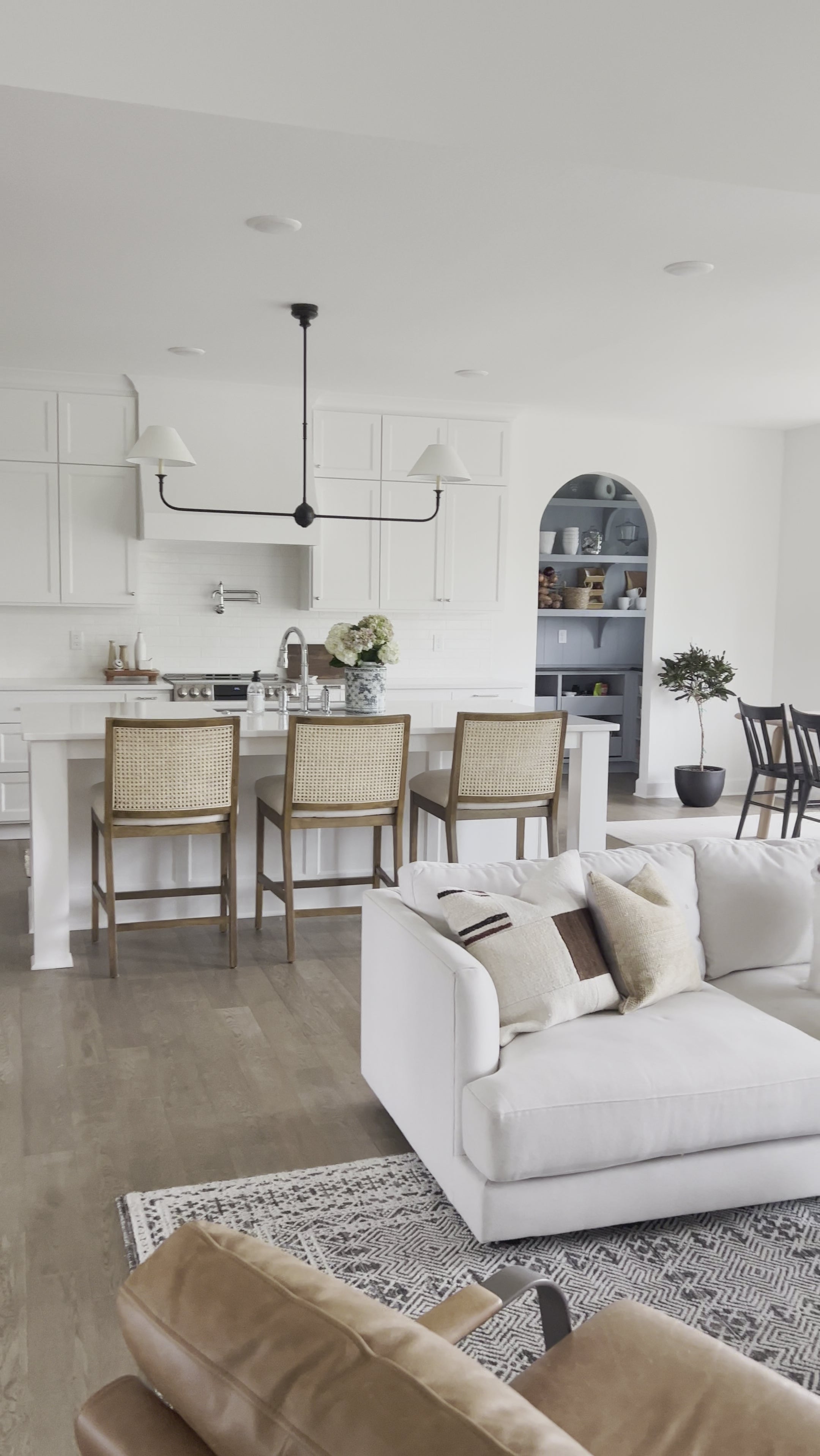 Finished in a beautifully classic washed oak, the Gregory Black Oak Dining Chair features a yoke-like back and widened supports, placing a fresh twist on the traditional Windsor. Amethyst Home provides interior design, new home construction design consulting, vintage area rugs, and lighting in the Winter Garden metro area.