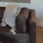 The Clemence Sofa features a minimalist design with clean, low-profile lines, complemented by plush cushions and luxurious throw pillows. Amethyst Home provides interior design, new home construction design consulting, vintage area rugs, and lighting in the Seattle metro area.