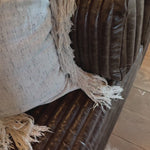 The Clemence Sofa features a minimalist design with clean, low-profile lines, complemented by plush cushions and luxurious throw pillows. Amethyst Home provides interior design, new home construction design consulting, vintage area rugs, and lighting in the Charlotte metro area.