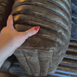 The Clemence Sofa features a minimalist design with clean, low-profile lines, complemented by plush cushions and luxurious throw pillows. Amethyst Home provides interior design, new home construction design consulting, vintage area rugs, and lighting in the Los Angeles metro area.