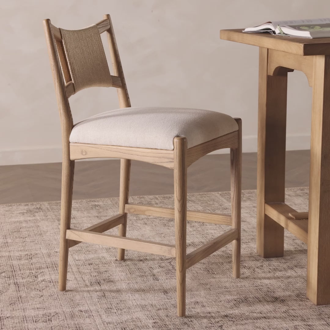 A curved back wrapped and textural woven paper cord take this everyday counter stool to new heights. Natural nettlewood frames a linen-blend seat for a clean look.Overall Dimensions: 19.75"w x 23.25"d x 39.25"hWeight : 19.51 lbsMaterials : 39% Linen, 35% Cotton, 26% Polyester, Solid Nettlewood, Rush Amethyst Home provides interior design, new home construction design consulting, vintage area rugs, and lighting in the Park City metro area.