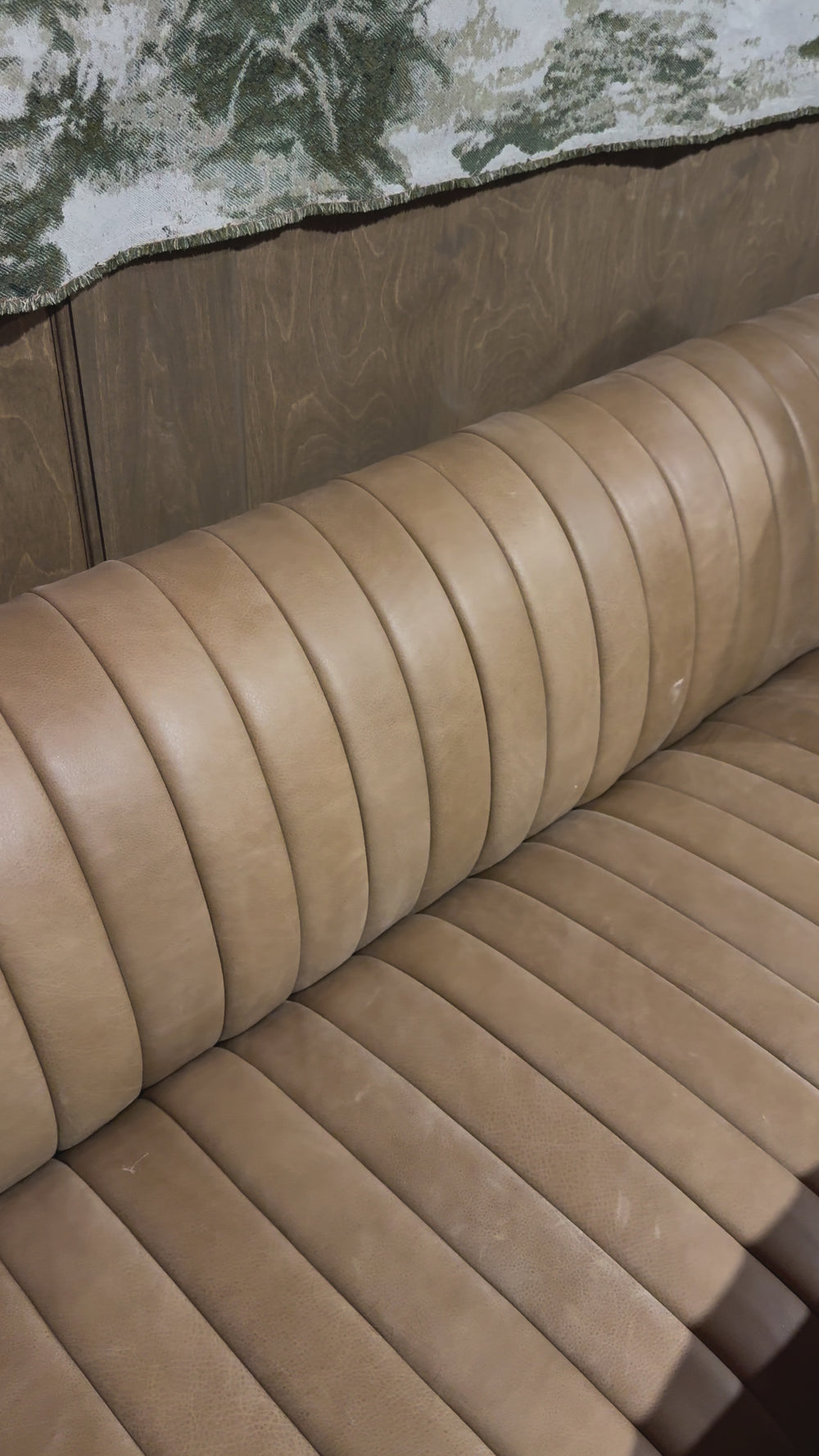 Welcome to your new favorite nook for morning coffee. An L-shaped dining banquette is upholstered in tan top-grain leather with a beautifully pronounced grain and dramatic channeling for a linear look. Perfectly sized for smaller spaces.Overall Dimensions: 100.00"w x 66.50"d x 31. Amethyst Home provides interior design, new home construction design consulting, vintage area rugs, and lighting in the Des Moines metro area.