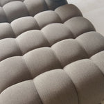 A modern take on mid-century Italian design, soft volume and exaggerated proportions fuse for a sculpted look and playful feel. Atop a plinth-style teak base, outdoor-friendly ottoman features dramatic tufting for a padded sit or a tray for use as a table, indoors and out. Ottoman to matching sectional. Amethyst Home provides interior design, new home construction design consulting, vintage area rugs, and lighting in the Alpharetta metro area.