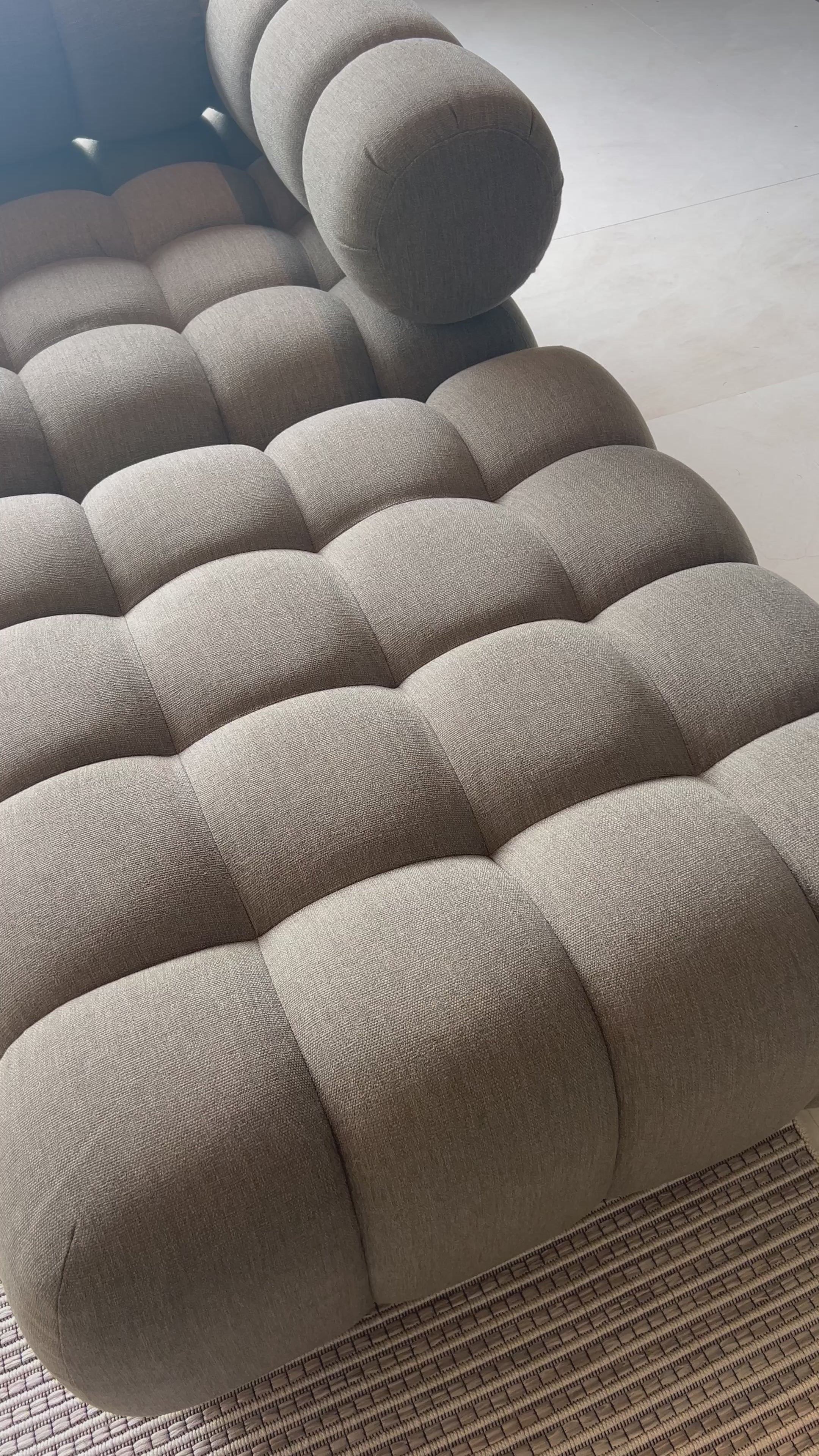 A modern take on mid-century Italian design, soft volume and exaggerated proportions fuse for a sculpted look and playful feel. Atop a plinth-style teak base, outdoor-friendly ottoman features dramatic tufting for a padded sit or a tray for use as a table, indoors and out. Ottoman to matching sectional. Amethyst Home provides interior design, new home construction design consulting, vintage area rugs, and lighting in the Alpharetta metro area.