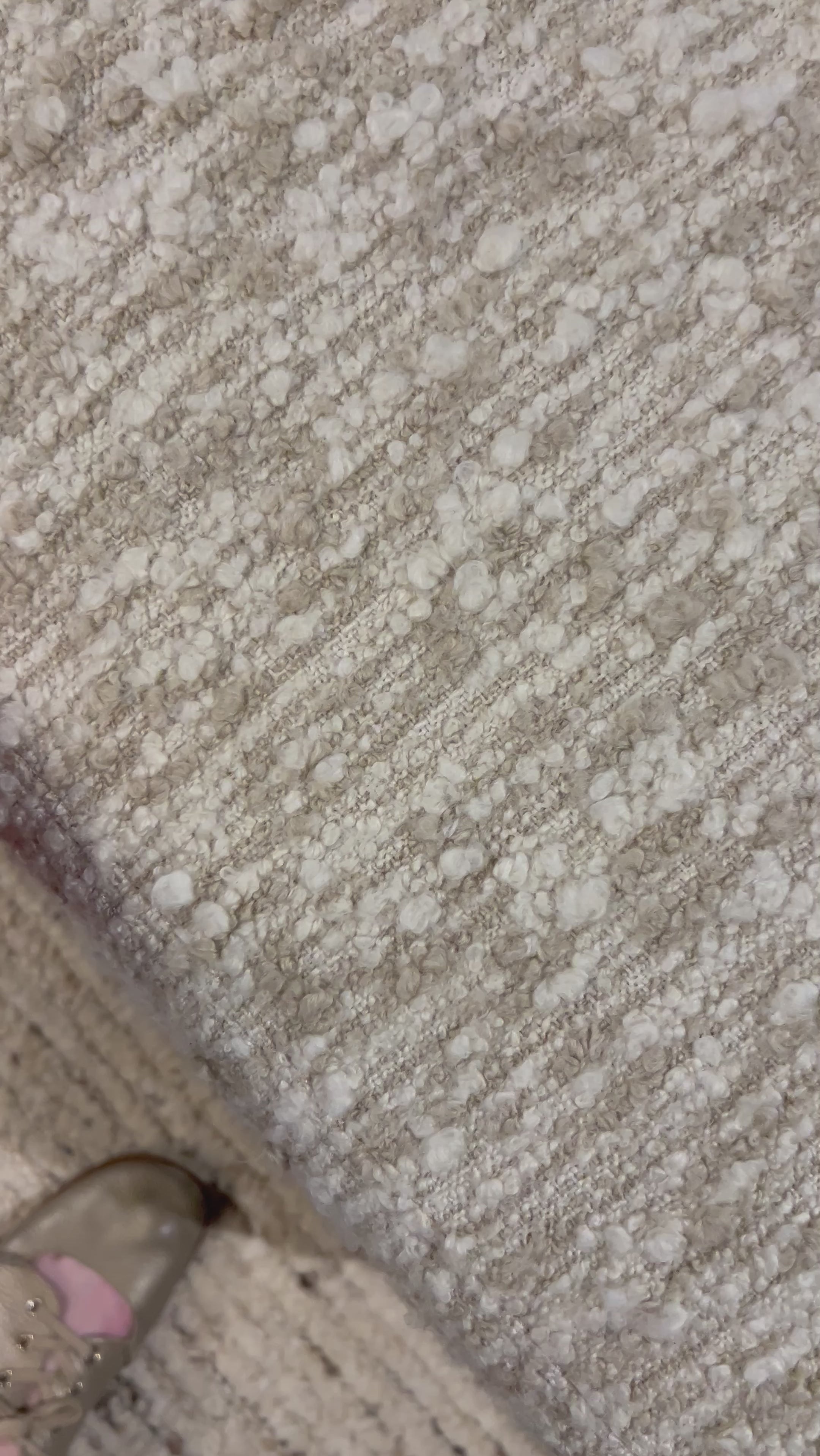 A modern take on a 70s-inspired shape. This sink-in, pillow-like chair features S-spring suspension for extra comfort and durability in the seat, all on a 360-degree swivel. Upholstered in an exaggerated boucle fabric with extra depth and texture throughout. Amethyst Home provides interior design, new home construction design consulting, vintage area rugs, and lighting in the Nashville metro area.