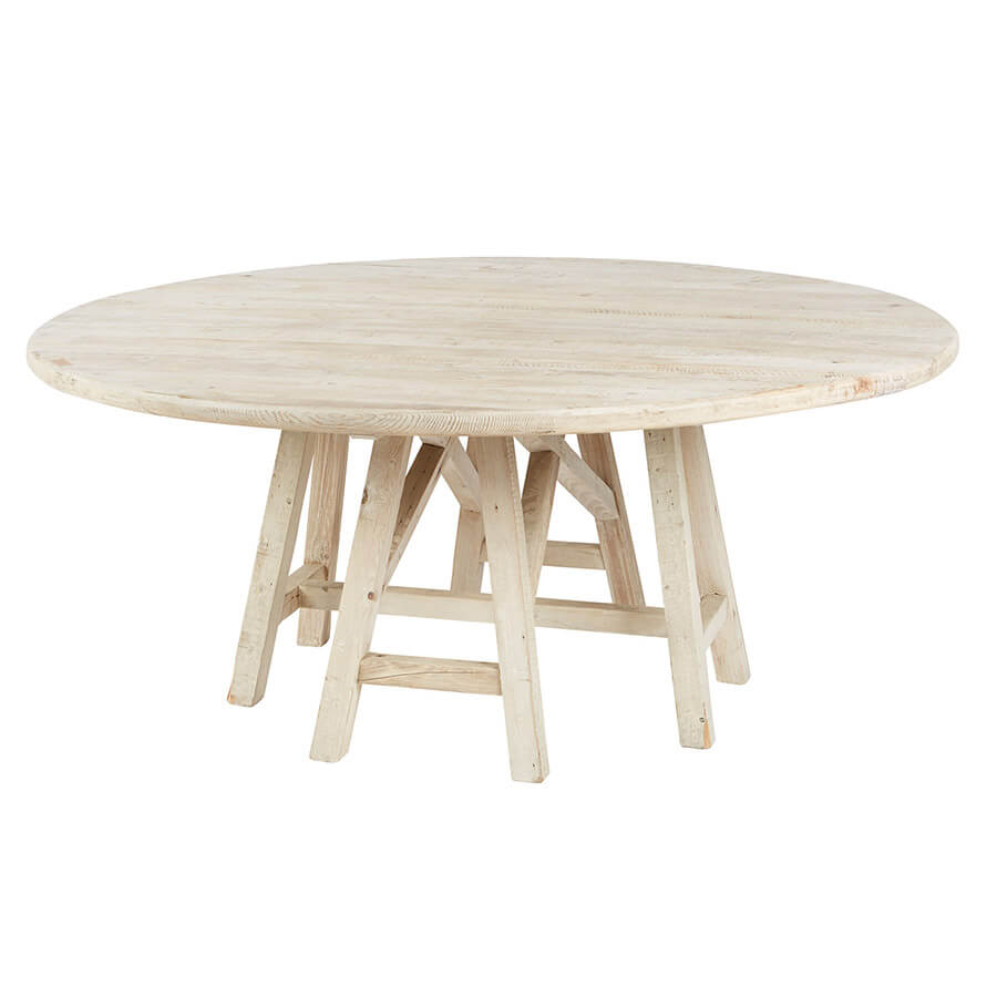 Combining the naturally bare look of white pine with a complex geometric base, this Round Trestle White Pine Table makes for a creative and sophisticated piece of furniture. Crafted with elegance, this gorgeous dining table is made of natural pine that has been cleverly softened by its white wash finish.  Size: 72"d x 30"h  Material: White Pine