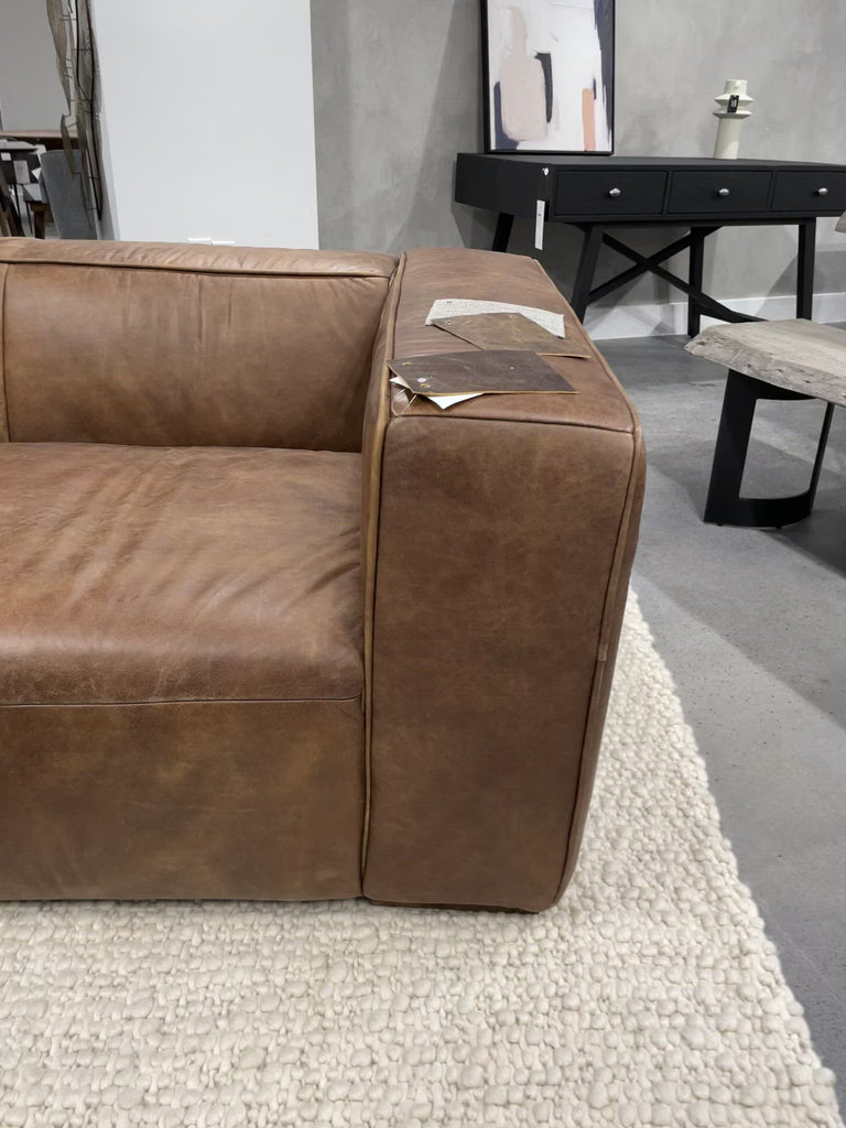 The Bolton Sofa's top-grain leather and minimalistic design combine to make a great first impression. With an ample seating area that will comfortably fit four people, this top-grain leather sofa is perfect for catching up with friends or on some much-needed sleep.  Size: 101"W x 44.5"D x 27.5"H