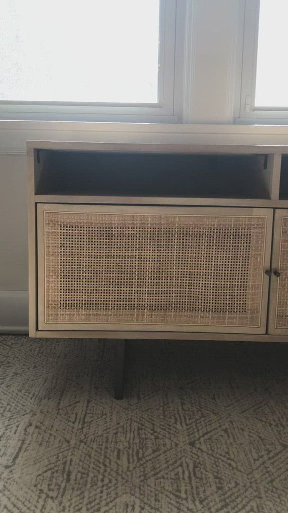 We love the organic feel of this Carmel Natural Mango Media Console. The shelves and posterior cord management make this the perfect media console for families wanting extra storage, while also adding a mid-century look to the room.   Size: 65"w x 18"d x 24"h