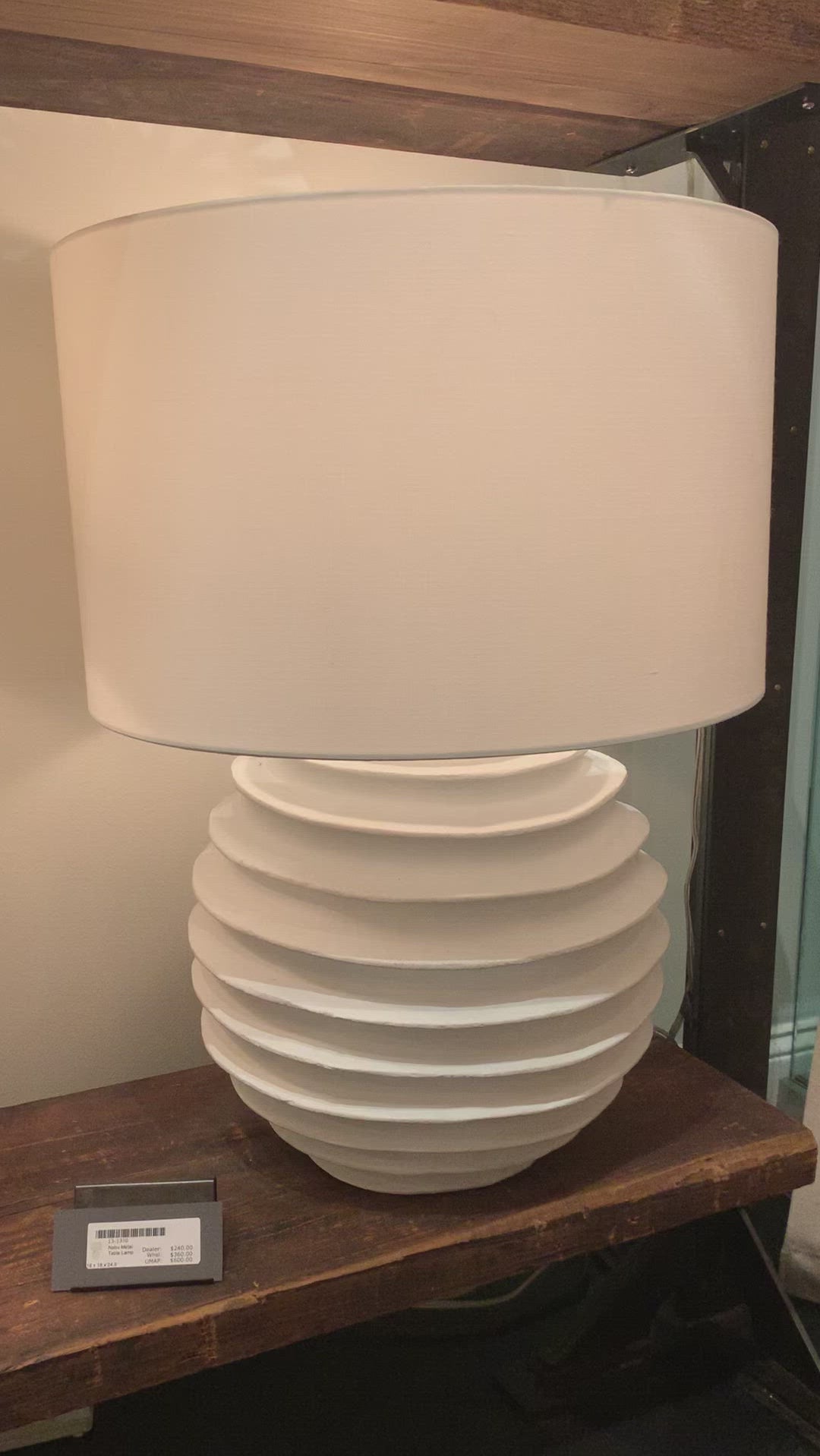 We love the accordion-like base of this Nabu Metal Table Lamp. It is a simple and beautiful lamp that adds warmth to any room.  Size: 18"w x 18"d x 24.5"h