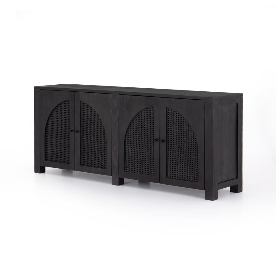 We love the textural cane door panels of the Tilda Black Wash Mango Sideboard. Store all your media needs while also adding a beautiful, monochromatic vibe to the room  Size: 78"w x 18"d x 33"h Materials: Solid Mango, Iron, Cane