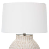 The Hobi Table Lamp has a gorgeous white-washed, natural woven pattern that catches our eye. The casual elegance in this lamp completes the look for any living room or bedroom.   Size: 18"w x 18"d x 26.5"h Material: Natural Material