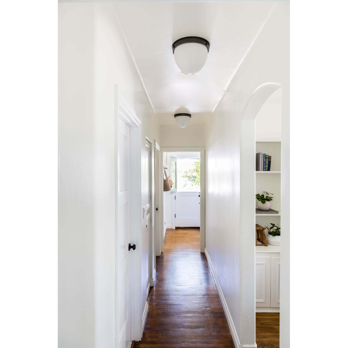 We love the warm and glowing look the white opal glass gives when illuminated in this Bay Harbor Oil Rubbed Bronze Flush Mount. This would look stunning in areas with lower ceilings or in hallways.   Size: 11"w x 11"d x 7.5"h Material: Steel