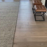 Inspired by textural watercolors, the Giana Charcoal Rug from Loloi combines a relaxed grid with soft variations of grey and ivory for an effortless and sophisticated look. Each rug is hooked of 100% wool by artisans for a beautiful textural layer to your home. The soft textures of this rug bring warmth and coziness to any room.  Hooked 100% Wool GH-01 Charcoal Colors: Grey, Ivory