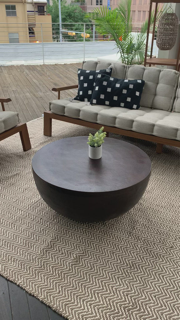 This Basil Outdoor Coffee Table - Antique Rust has an antique rust finish that highlights aluminum's natural depth, for a sleek, simple look with implied movement. Cover or store indoors during inclement weather and when not in use.  Overall Dimensions: 36.00"w x 36.00"d x 15.00"h