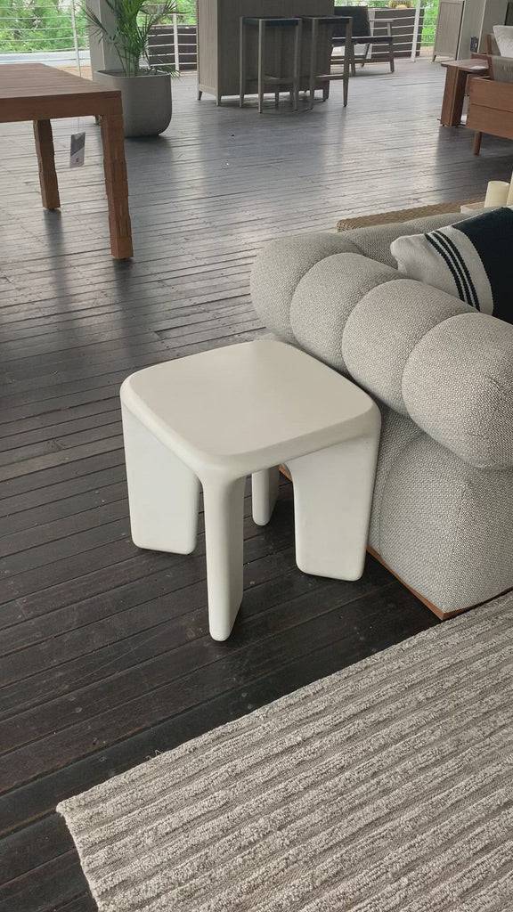A minimalist dream, this Dante End Table - White Concrete is made from white-finished cast concrete with soft, chunky proportions. This would elevate the space for any living room or lounge area.    Overall Dimensions: 19.00"w x 19.00"d x 19.00"h