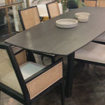 We love the airy base of this Caesar Dining Table. Made of teak wood, this is a sturdy table to add to any dining room or kitchen area.  Teak wood Antique black finish Size: 95"l x 40"d x 33"h 