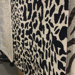 Hooked of 100% wool, this Masai Collection is a softer side of the savannah brought to life by artisans in India. Masai is a beautiful contemporary rug with contrasting hues and is a chic twist on the classic animal print.  Hooked 100% Wool MAS-02 Black / Ivory