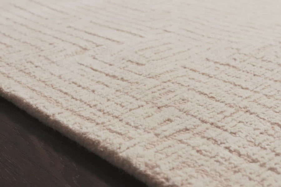 With stunning and delicate linear patterns, the Kopa Collection provides an energetic and fresh canvas for a low profile, long-lasting 100% wool rug. Each design is hand-tufted by skilled artisans in India. Crafted by Loloi for ED Ellen DeGeneres.  Hand Tufted 100% Wool India KO-06 ED Blush/Ivory