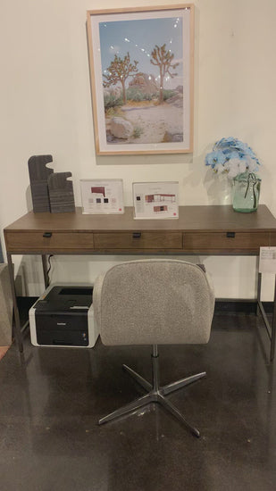 Inspired by clean mid-century design, grey-ish auburn poplar offers plenty of desk storage by way of three spacious drawers. Metal-secured leather pulls add a textural element of surprise. Great solo or paired with matching corner desk, file cabinet or credenza.  Size: 59.75"w x 22"d x 31.25"h