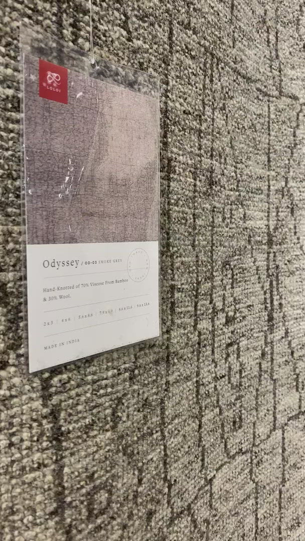 Drawing inspiration from tribal influences, the Odyssey Collection combines relaxed linear pattern with a sophisticated color palette. Each Odyssey rug, which is hand-knotted of wool and viscose from bamboo, is crafted entirely by hand by master artisans in India.  Hand Knotted 70% Viscose from Bamboo | 30% Wool OD-03 Smoke/Grey