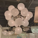 We love the white strie glass globes on this Cristol Large Chandelier by Visual Comfort. It brings a stunning and unique look to any living room, dining room, or kitchen.  Designer: AERIN