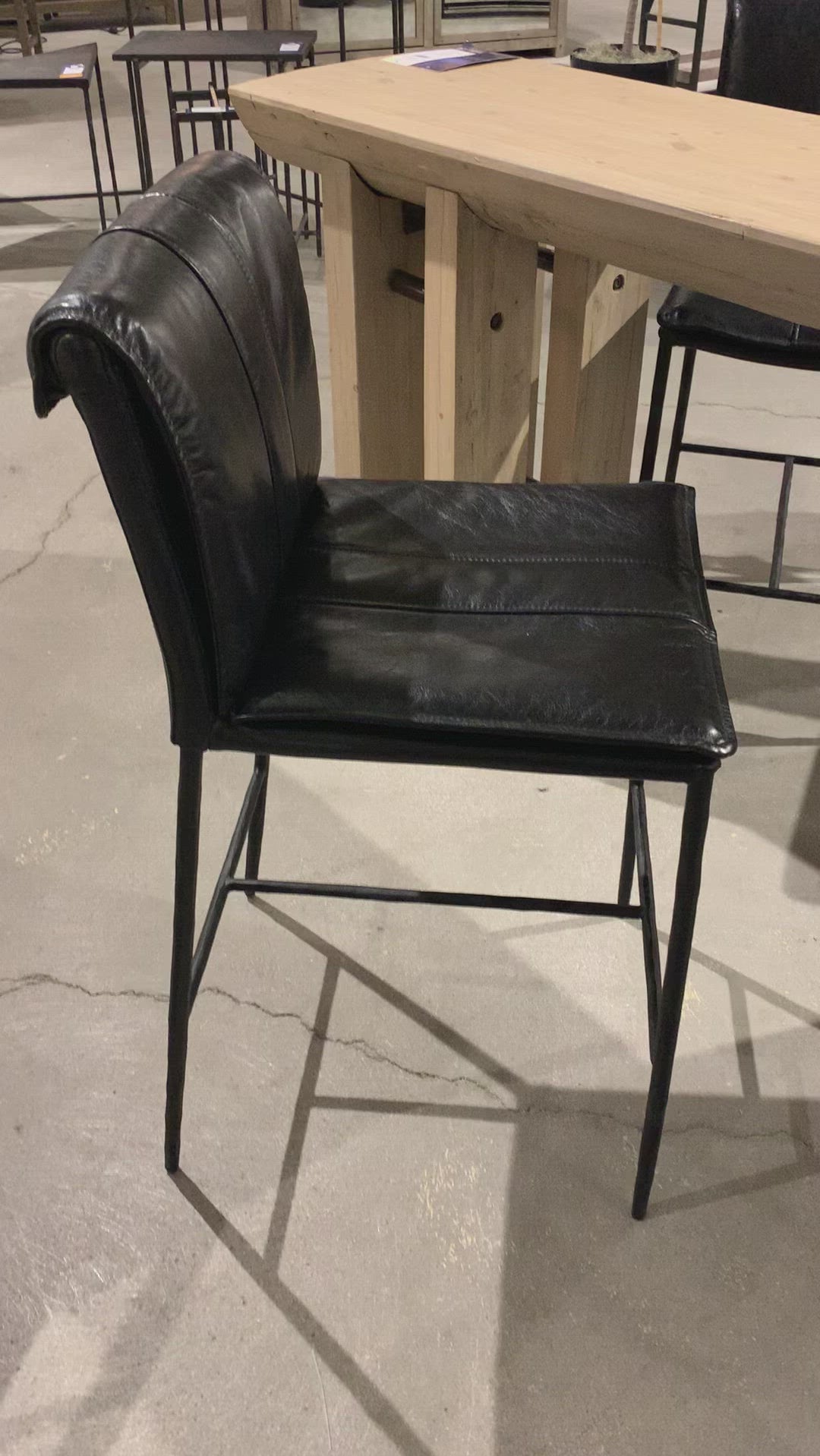 We the love the sleek look the black top grain leather brings to this Mayer Bar + Counter Stool - Black -- the perfect stool for any kitchen or bar area. 