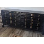 Crafted in vintage black mango wood and with brass hardware the Printmakers Console has been reconfigured to accommodate more space while retaining its classic form. There are 12 drawers for storage. This console is currently in the shop!  Size:  69"w x 13"d x 31"h