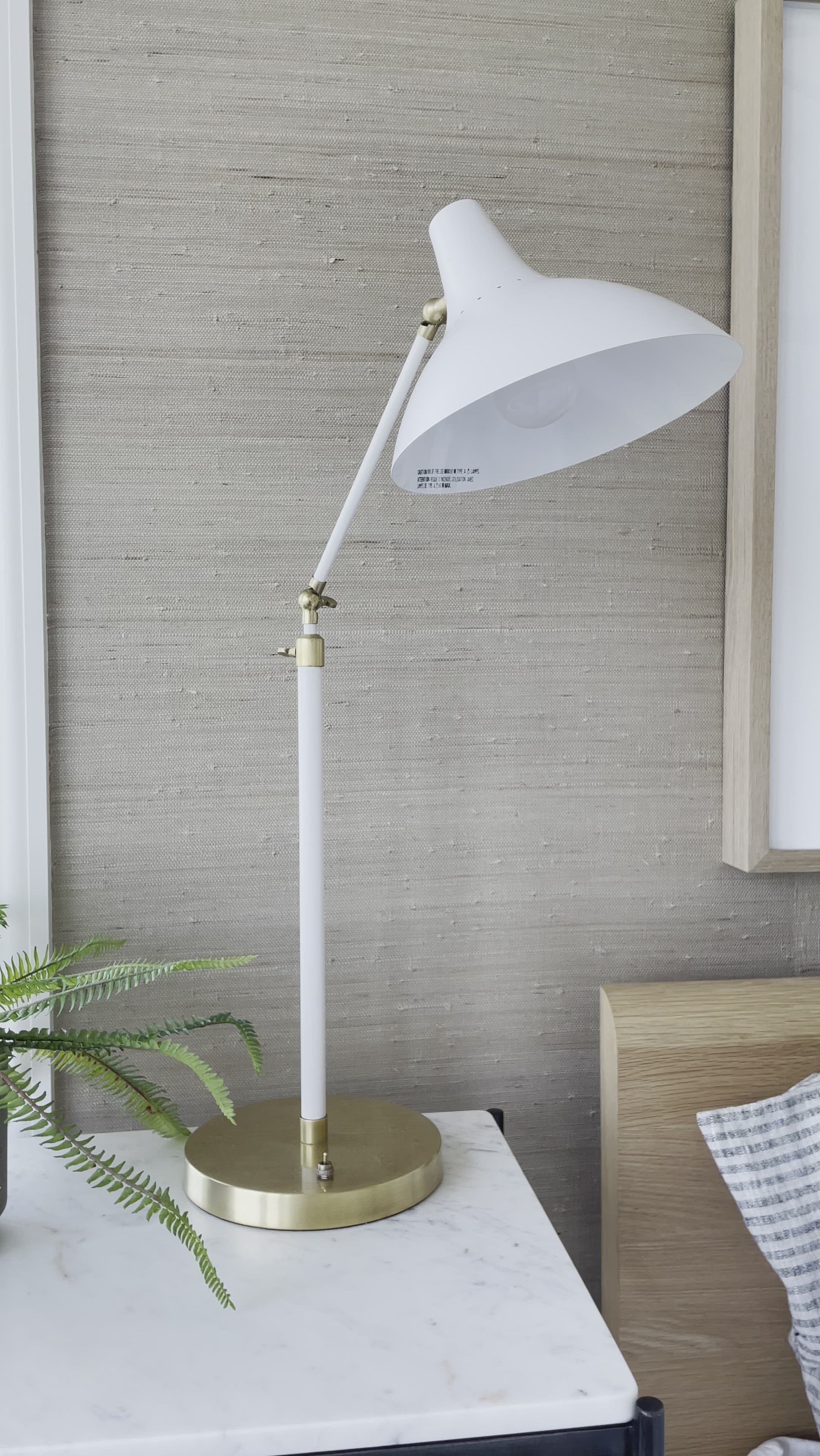 We love the hand-rubbed antique brass matched with either plaster white or black in this Charlton Table Lamp. This is the perfect lamp for your office, bedroom, or other space needing controlled light.   Designer: AERIN