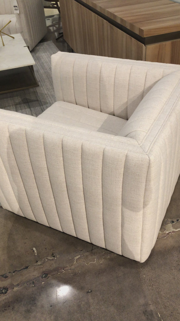 You will love the dramatic channeling of this Augustine Cream Swivel Chair. The swivel feature sets this apart from other chairs and is a great choice for any living room or media room. This chair is comfort wrapped in soft linen blend making this everyone's favorite chair.  Overall Dimensions: 32.00"w x 34.00"d x 26.50"h