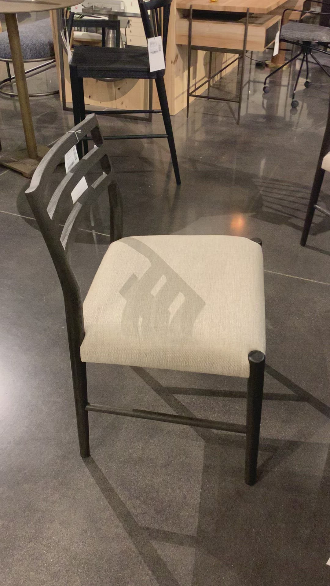 We love the ladderback chair of this Glenmore Light Carbon Dining Chair. The carbon-toned seating blends cotton with linen and elevates the space for any dining room or kitchen area.   Overall Dimensions: 21.75"w x 22.00"d x 34.00"h Seat Depth: 17.72" Seat Height: 18.9"