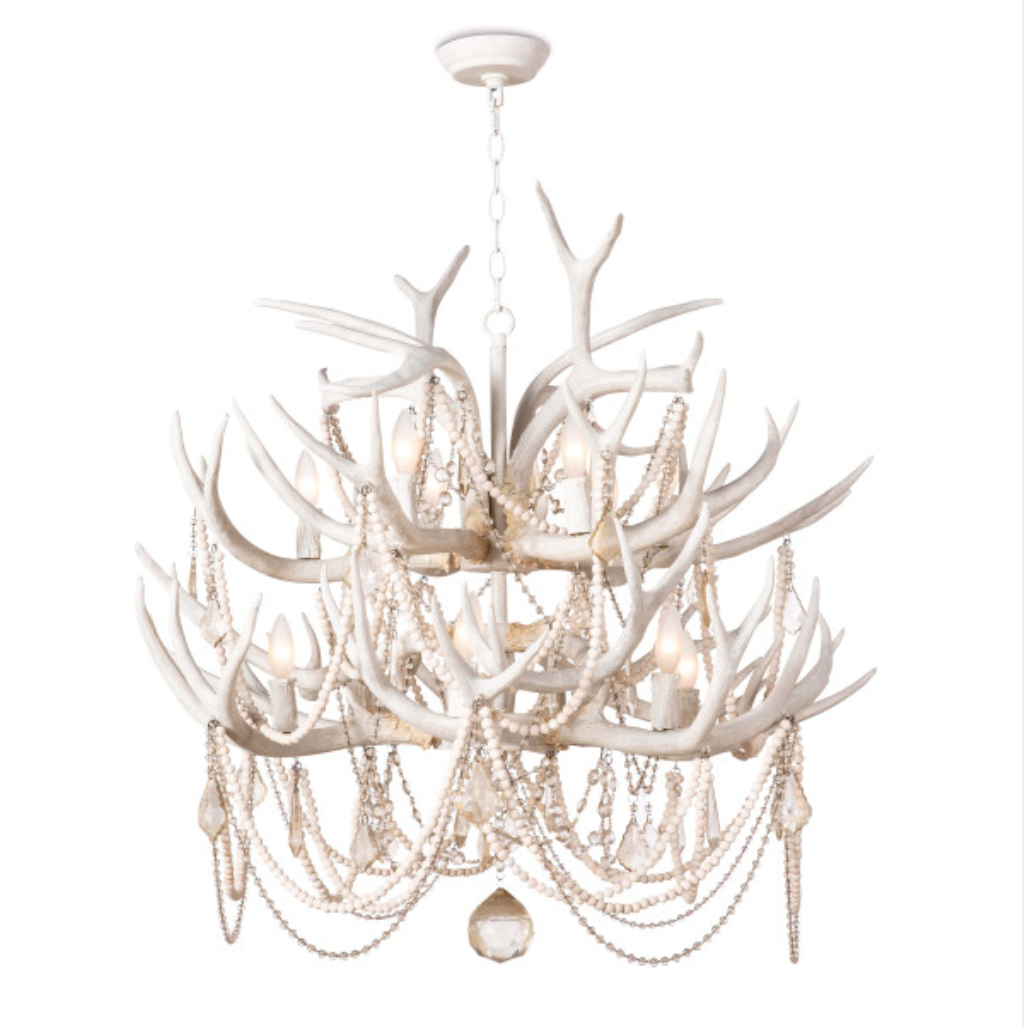 Rustic meets luxe vibe with this Cheyanne Antler Chandelier by Regina Andrew. The antlers matched with the tea stained crystals make a statement in any living room, entryway or other area needing extra light.   Overall Dimensions: 33"w x 33"d x 40"h