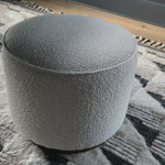 This round ottoman of textural cream boucle can be placed just about anywhere, bringing with it a hip retro vibe.  Size: 22" w x 22" d x 18.5" h  Colors: Distressed Natural, Knoll Natural Materials: Solid Parawood, 95% Polyester, 5% Pc   