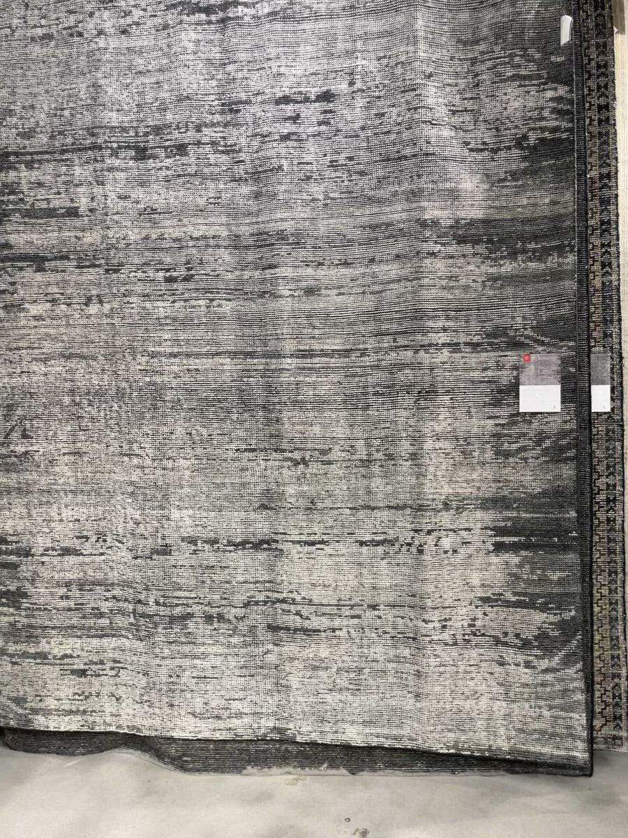 Hand-knotted in India of 100% wool, the Amara Silver/Dark Grey Rug creates a casual yet refined vibe with high-end appeal. Showcase in your bedroom, living room, entryway, or other high-traffic area of your home.   Hand Knotted 100% Wool AMM-02 Silver/Dark Grey