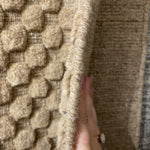 Natural beauty is expressed in an understated fashion with the Hadley Dune Area Rug, an eco-friendly collection of wool, cotton, and polyester. Loom-knotted in India, Hadley features an intriguing cut pile and loop combination which adds distinctive texture to these handsome and durable designs. Also, the muted colors fit easily with a variety of interior styles while still earning notice with raw elegance.  Hand Loomed 64% Wool | 22% Cotton | 9% Polyester | 5% Other Fibers HD-02 Dune