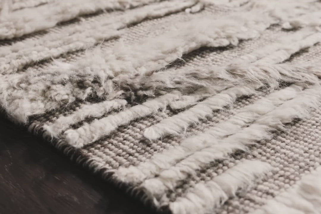 A nod to timeless Moroccan style, the Khalid Collection is hand-knotted in India by skilled artisans. The soft pile features 100% natural, undyed wool, lending slight variations in tones that make each piece it's own. Plus, each rug is finished with a thoughtfully designed fringe.  Hand-Knotted 100% Wool KF-07 Ivory/Taupe