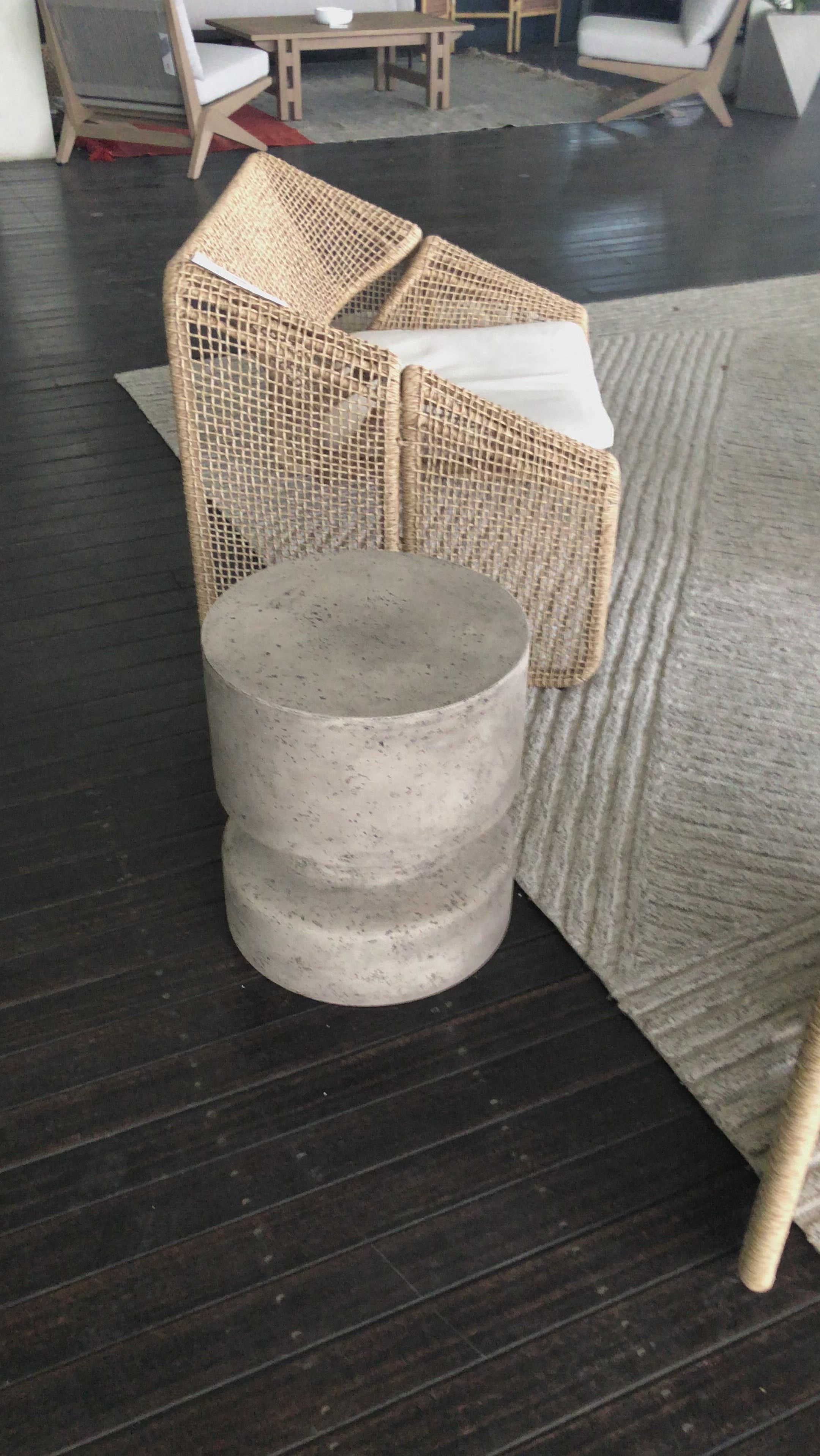Made from solid concrete, this Nahla Outdoor End Table - Graphite is both sturdy and durable. Perfect for layering in as a sturdy extra surface, indoors or out. Distressing will vary slightly from piece to piece, given concrete's organic nature. Cover or store inside during inclement weather and when not in use.  Overall Dimensions: 15.75"w x 15.75"d x 17.75"h