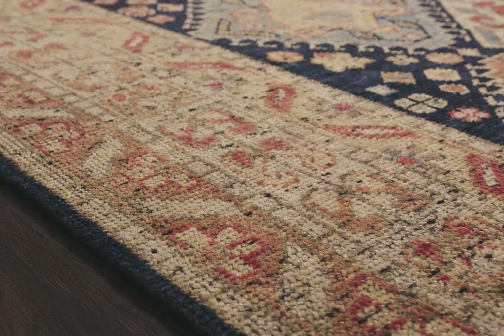 Bring a touch of antiqued beauty into your home with our Heirloom collection. This 100% wool collection tastefully honors the art of hand knotted rugs from India. Heirloom evokes a sense of unique sophistication with its traditional Serapi rug color palettes and vintage design.  Hand Knotted 87% Wool | 13% Cotton HQ-01 Navy/Multi
